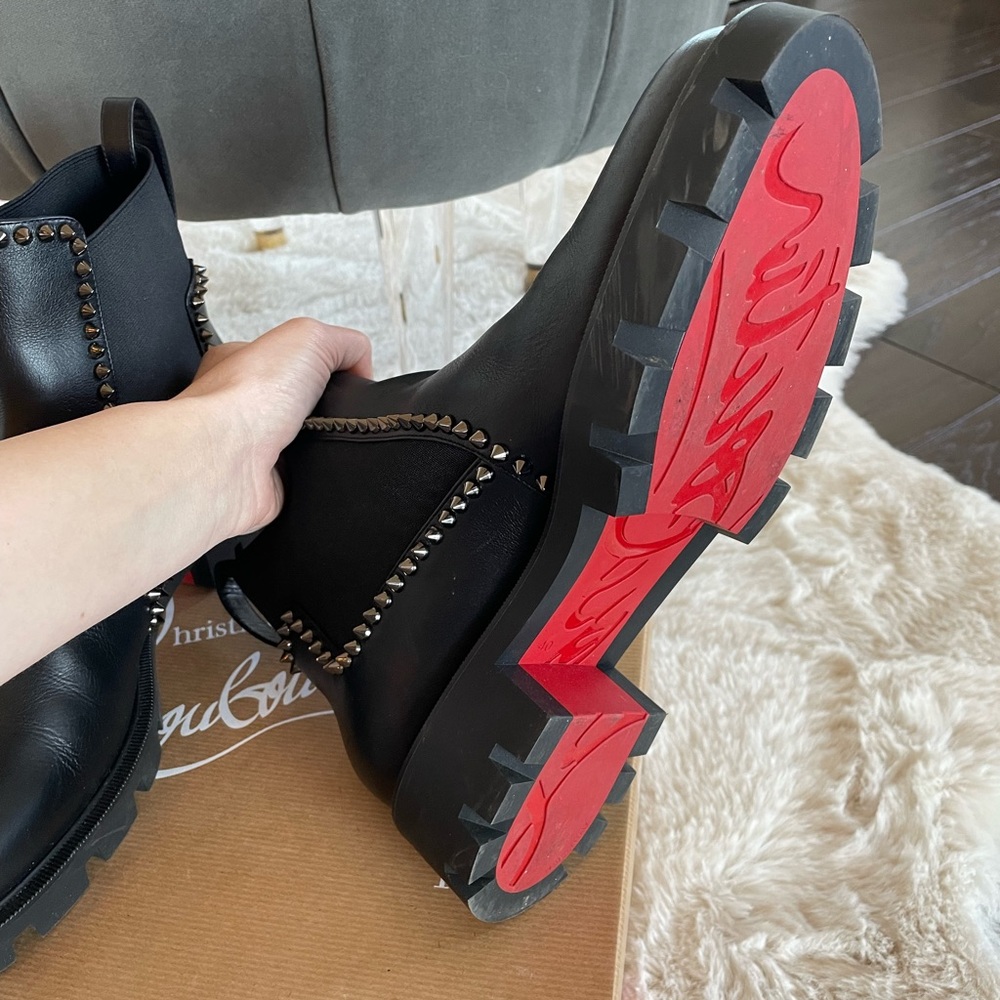 Out Lina spike red sole ankle boots.
